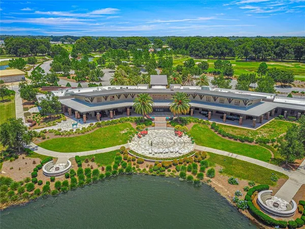 an aerial view of a house with outdoor space swimming pool and outdoor seating