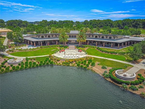an aerial view of a house with outdoor space swimming pool and outdoor seating
