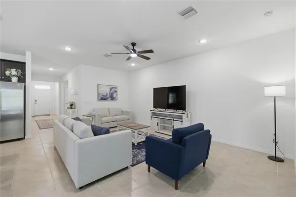 a living room with furniture and a window