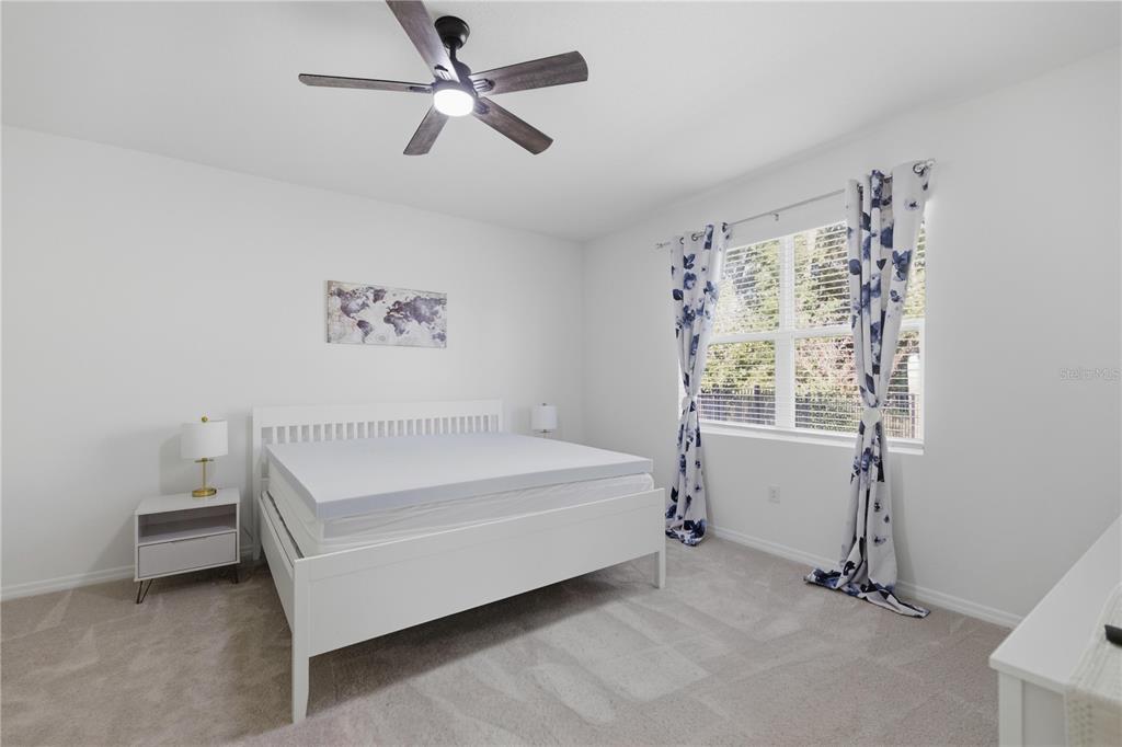 5157 Northwest 43rd Ln Road Ocala, FL 34482 - Photo 10 of 70 a bed sitting in a room next to a window