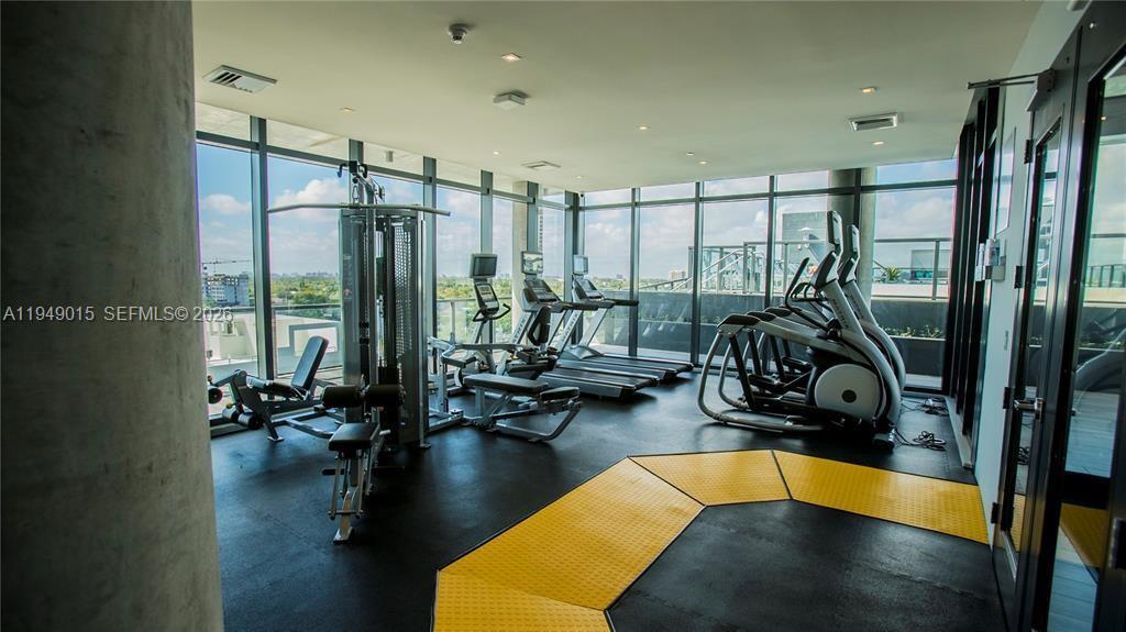201 Southwest 17th Road, Unit 603 Miami, FL 33129 - Photo 13 of 23 a view of a room with gym equipment