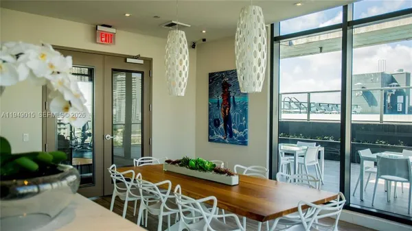 a view of a dining room with furniture window and outside view