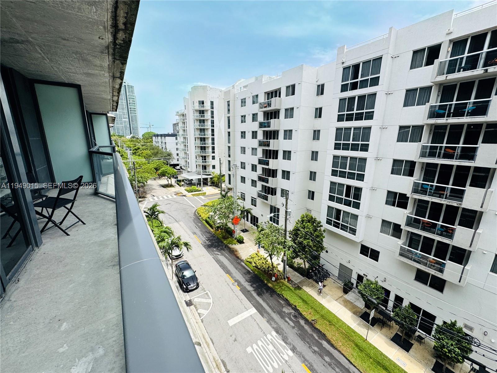 201 Southwest 17th Road, Unit 603 Miami, FL 33129 - Photo 8 of 23 a view of a balcony with chairs and potted plants
