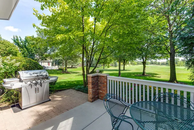 a view of a deck and a backyard