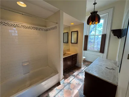 a kitchen with stainless steel appliances granite countertop a refrigerator a stove a sink dishwasher and a refrigerator