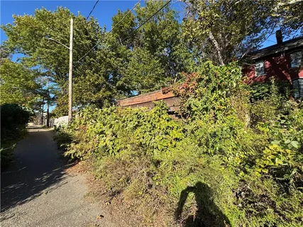 a kitchen with a sink a stove and a microwave