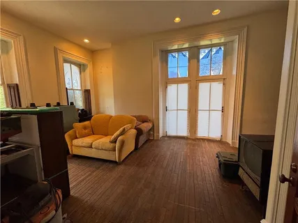 a bedroom with furniture and a window