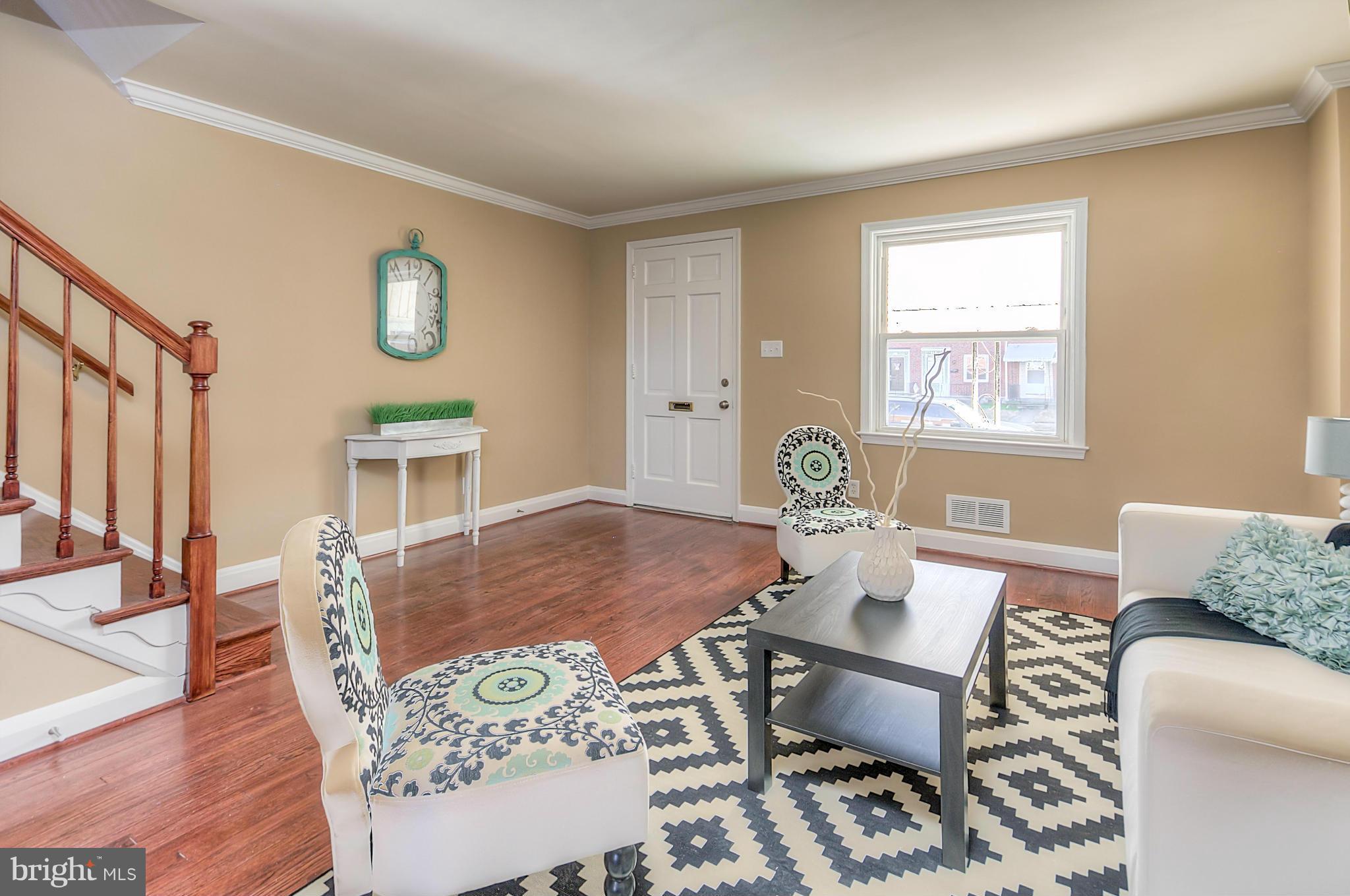 2159 Coralthorn Road Baltimore, MD 21220 - Photo 2 of 16 a living room with furniture and wooden floor