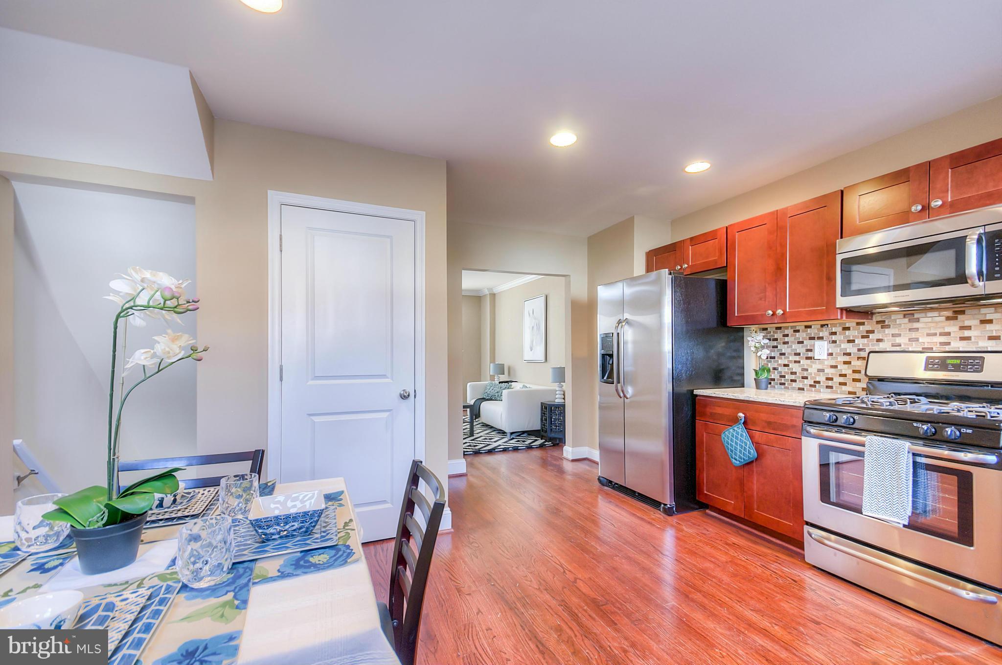 2159 Coralthorn Road Baltimore, MD 21220 - Photo 3 of 16 a large white kitchen with stainless steel appliances