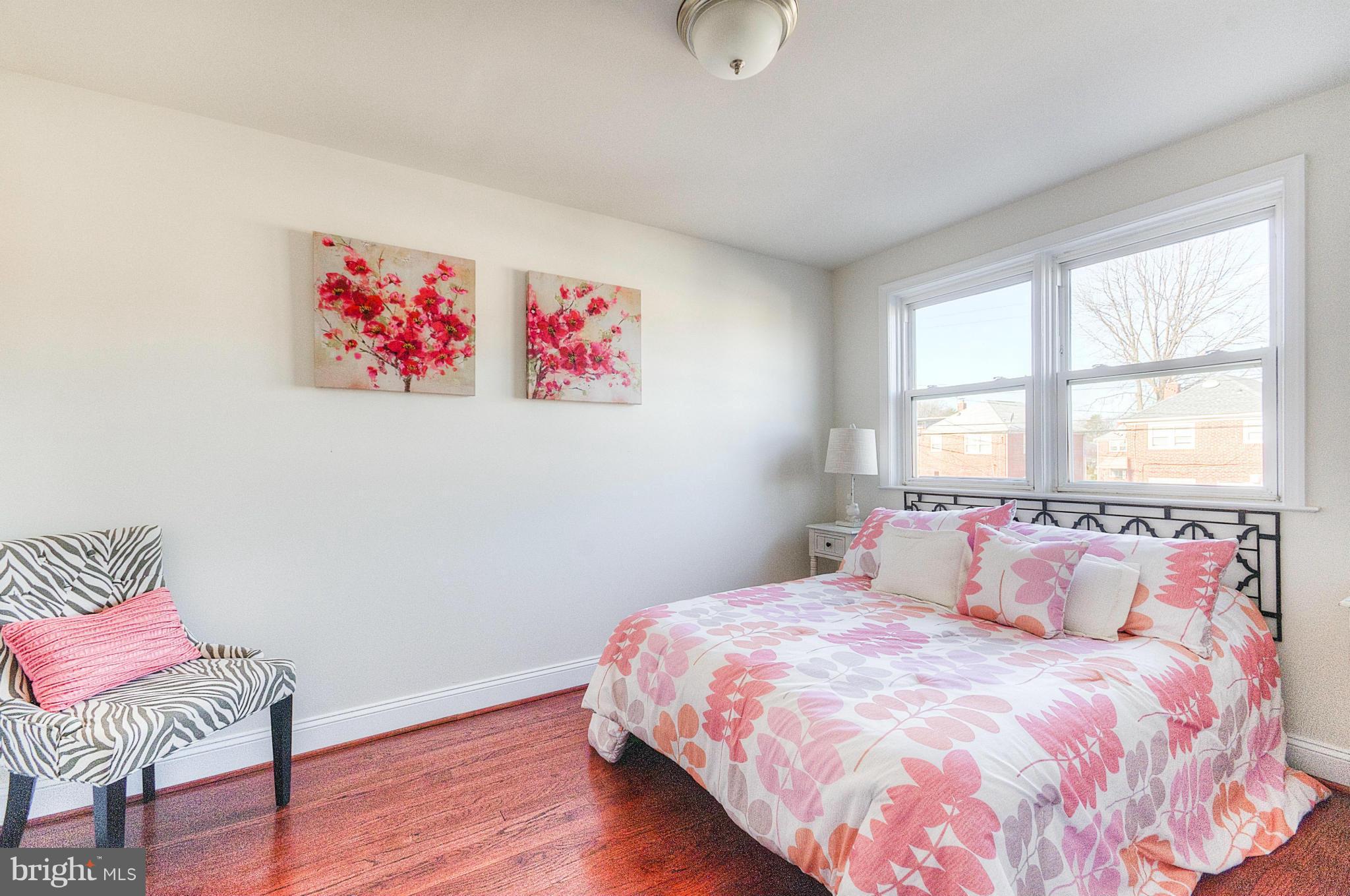 2159 Coralthorn Road Baltimore, MD 21220 - Photo 7 of 16 a bedroom with a bed and wooden floor