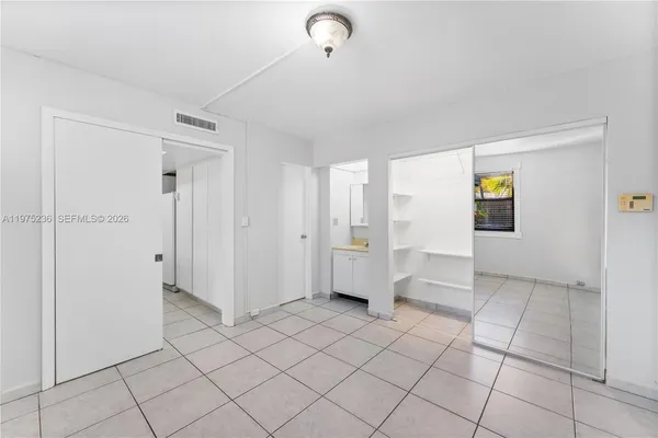 a view of an empty room and window