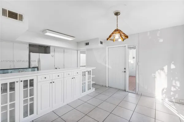 a view of a kitchen with cabinets