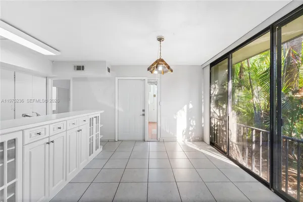 a bathroom with a sink a large mirror and a shower