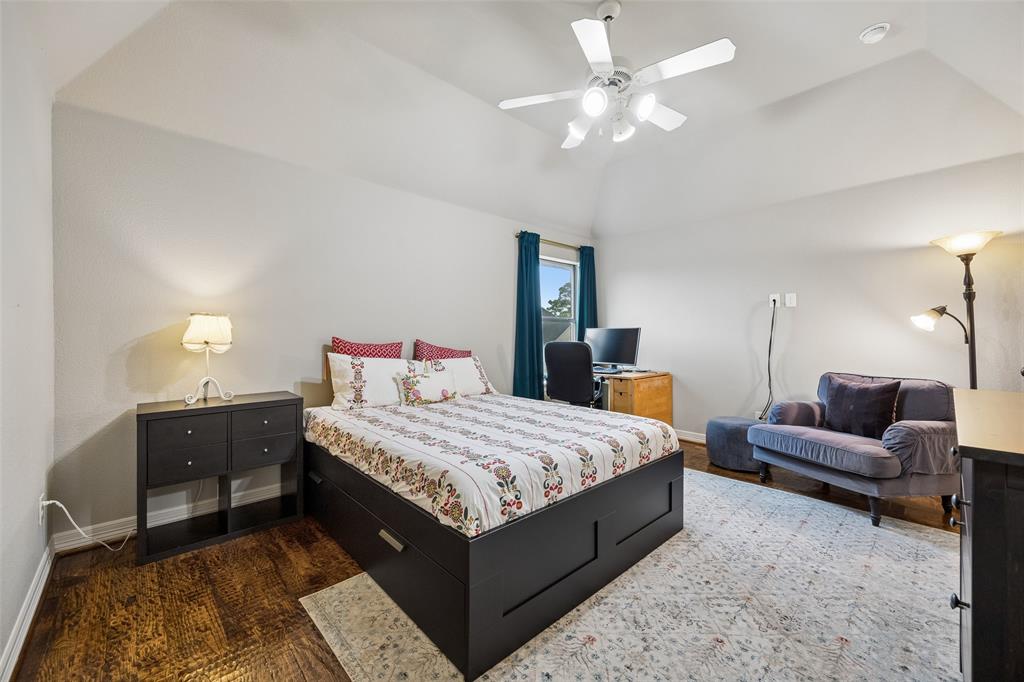1608 Tuscan Ridge Circle Southlake, TX 76092 - Photo 24 of 36 a bedroom with a bed and a couch
