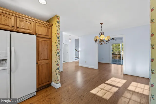 a white refrigerator freezer sitting inside of a kitchen