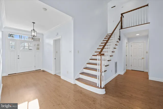 a view of entryway with wooden floor