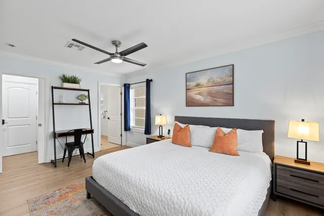 a spacious bedroom with a bed and a couch