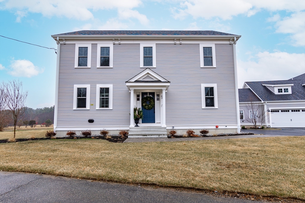 a front view of a house with a yard