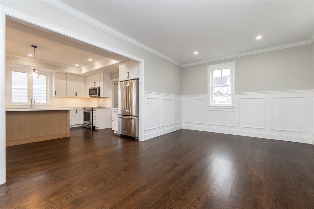 83 East Main Street Hopkinton, MA 01748 - Photo 15 of 42 a view of an empty room with a kitchen and a window