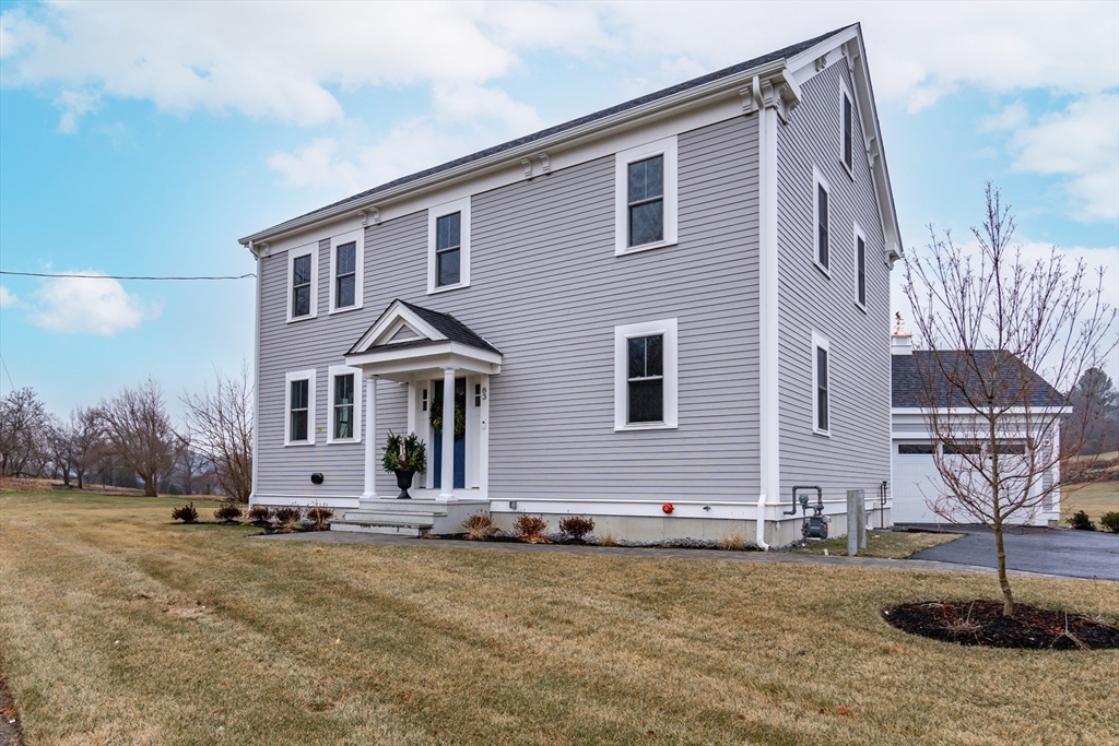 83 East Main Street Hopkinton, MA 01748 - Photo 2 of 42 a front view of a house with yard