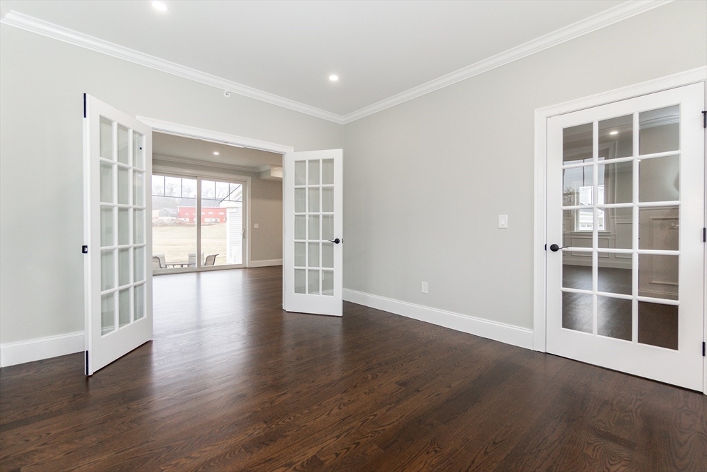 83 East Main Street Hopkinton, MA 01748 - Photo 21 of 42 a view of an empty room with wooden floor and a window