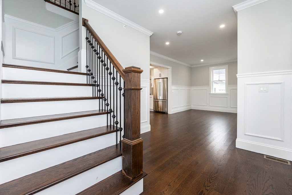 83 East Main Street Hopkinton, MA 01748 - Photo 22 of 42 a view of entryway and hall with wooden floor