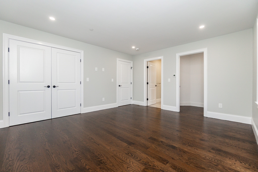 83 East Main Street Hopkinton, MA 01748 - Photo 26 of 42 a view of an empty room with wooden floor