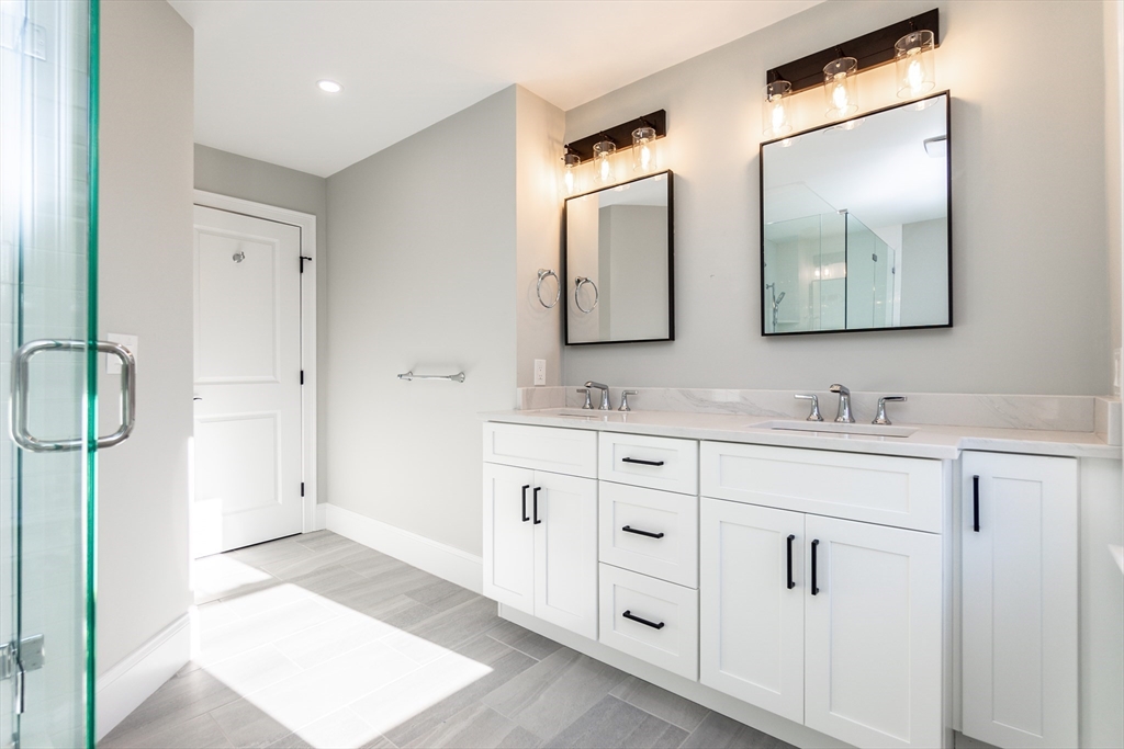 83 East Main Street Hopkinton, MA 01748 - Photo 31 of 42 a bathroom with double sink and a mirror