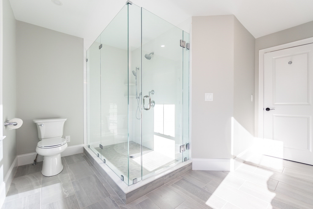 83 East Main Street Hopkinton, MA 01748 - Photo 32 of 42 a bathroom with a sink a toilet and shower