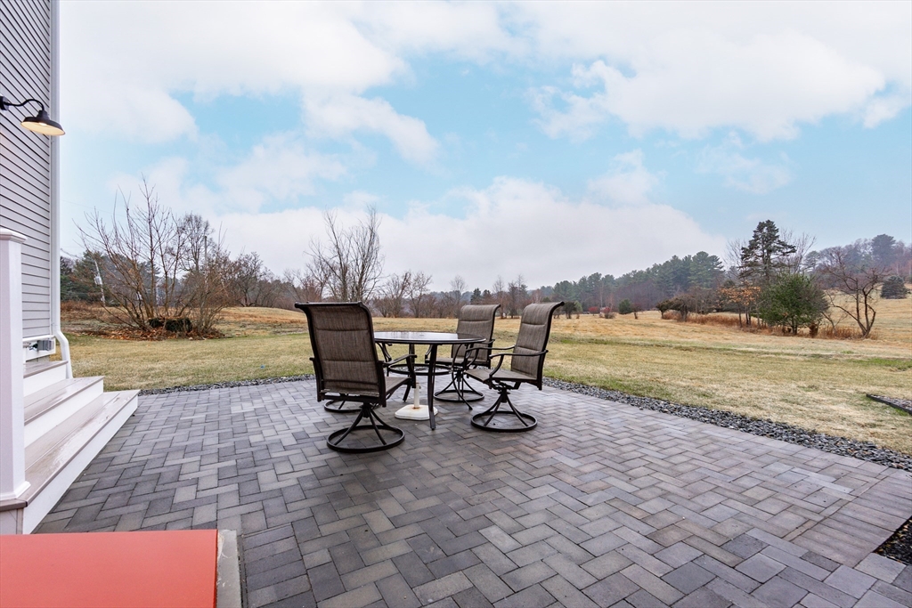 83 East Main Street Hopkinton, MA 01748 - Photo 38 of 42 a view of a lake with table and chairs