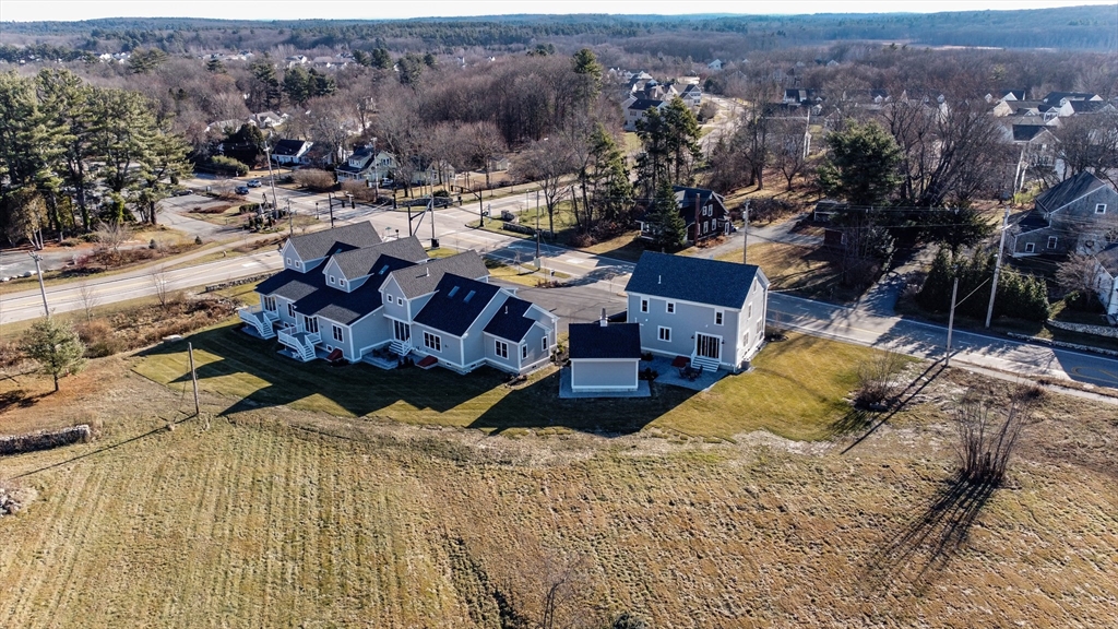 83 East Main Street Hopkinton, MA 01748 - Photo 39 of 42 a view of a house with a yard
