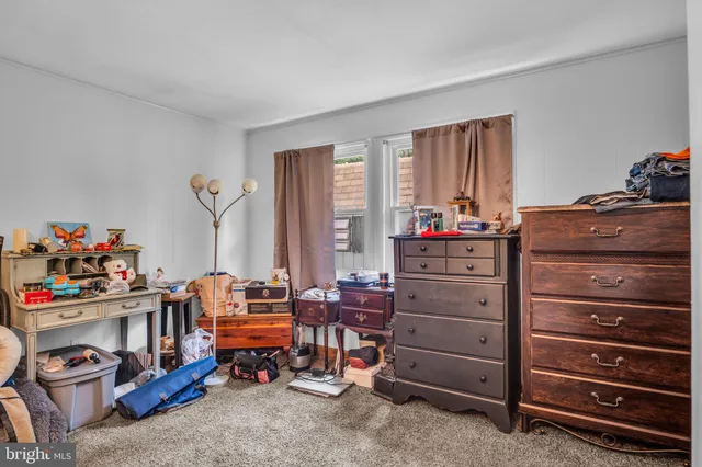 a room with furniture and a dresser