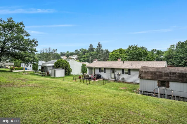 a view of a house with a big yard
