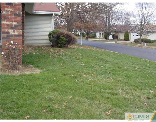 230 Convent Road Monroe Township, NJ 08831 - Photo 13 of 14 a view of a house with a yard