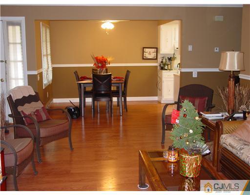 230 Convent Road Monroe Township, NJ 08831 - Photo 14 of 14 a dining room with furniture and wooden floor