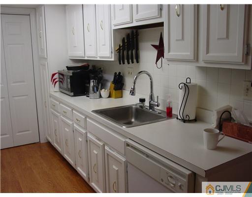 230 Convent Road Monroe Township, NJ 08831 - Photo 5 of 14 a kitchen with stainless steel appliances granite countertop a sink and cabinets