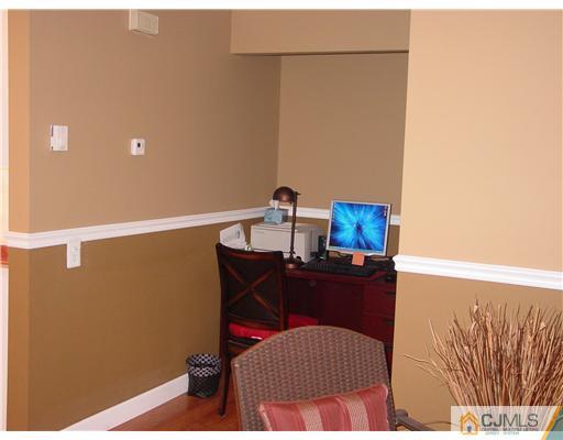 230 Convent Road Monroe Township, NJ 08831 - Photo 7 of 14 a room with a table and a mirror