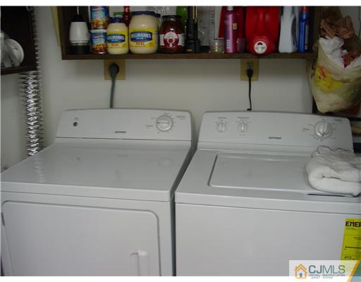230 Convent Road Monroe Township, NJ 08831 - Photo 10 of 14 a utility room with dryer and washer