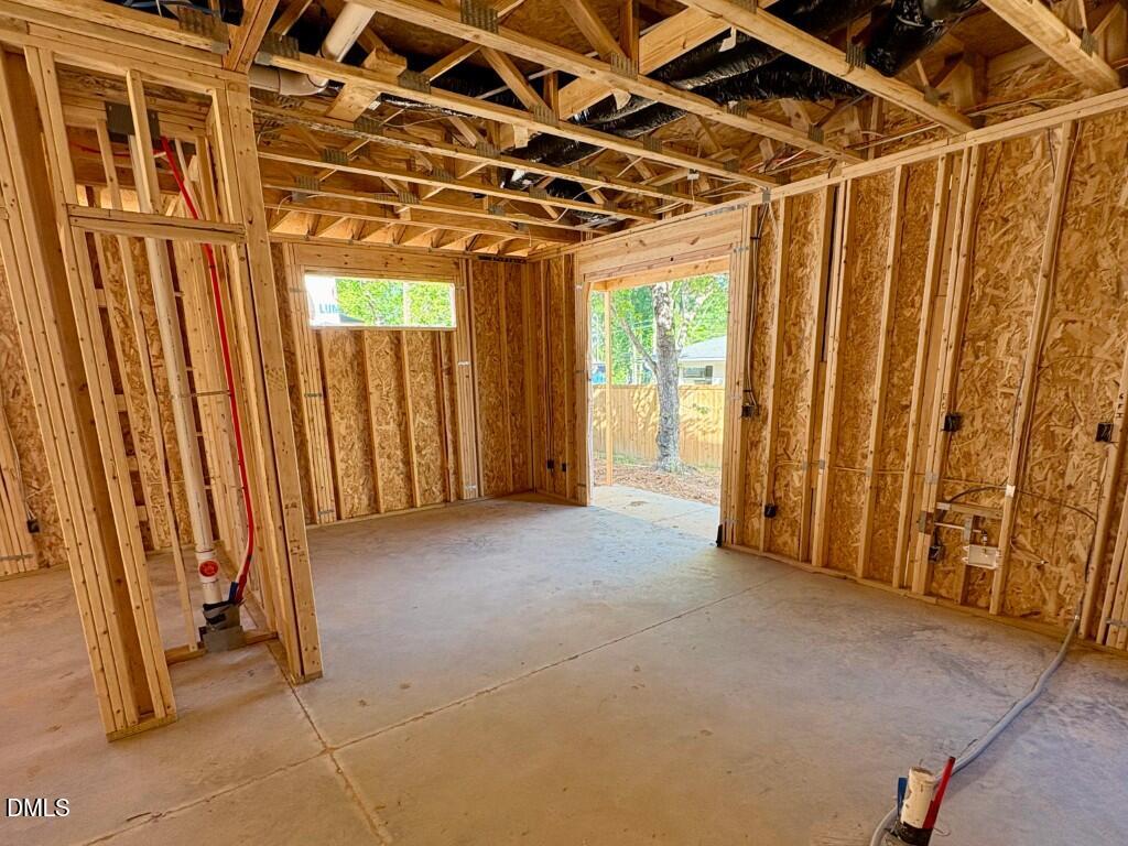 2941 Duke Homestead Road Durham, NC 27705 - Photo 6 of 13 a view of a room with wooden walls and iron stairs