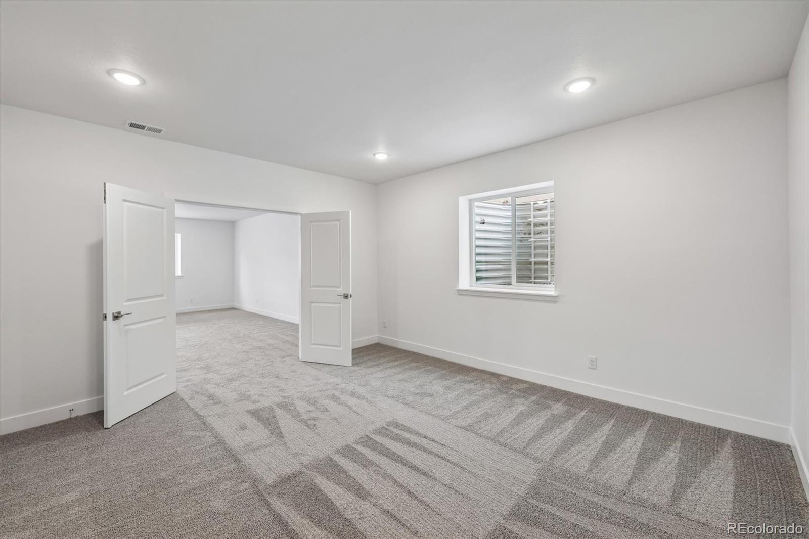 2516 West Bitterroot Place Highlands Ranch, CO 80129 - Photo 19 of 24 an empty room with a empty space and windows