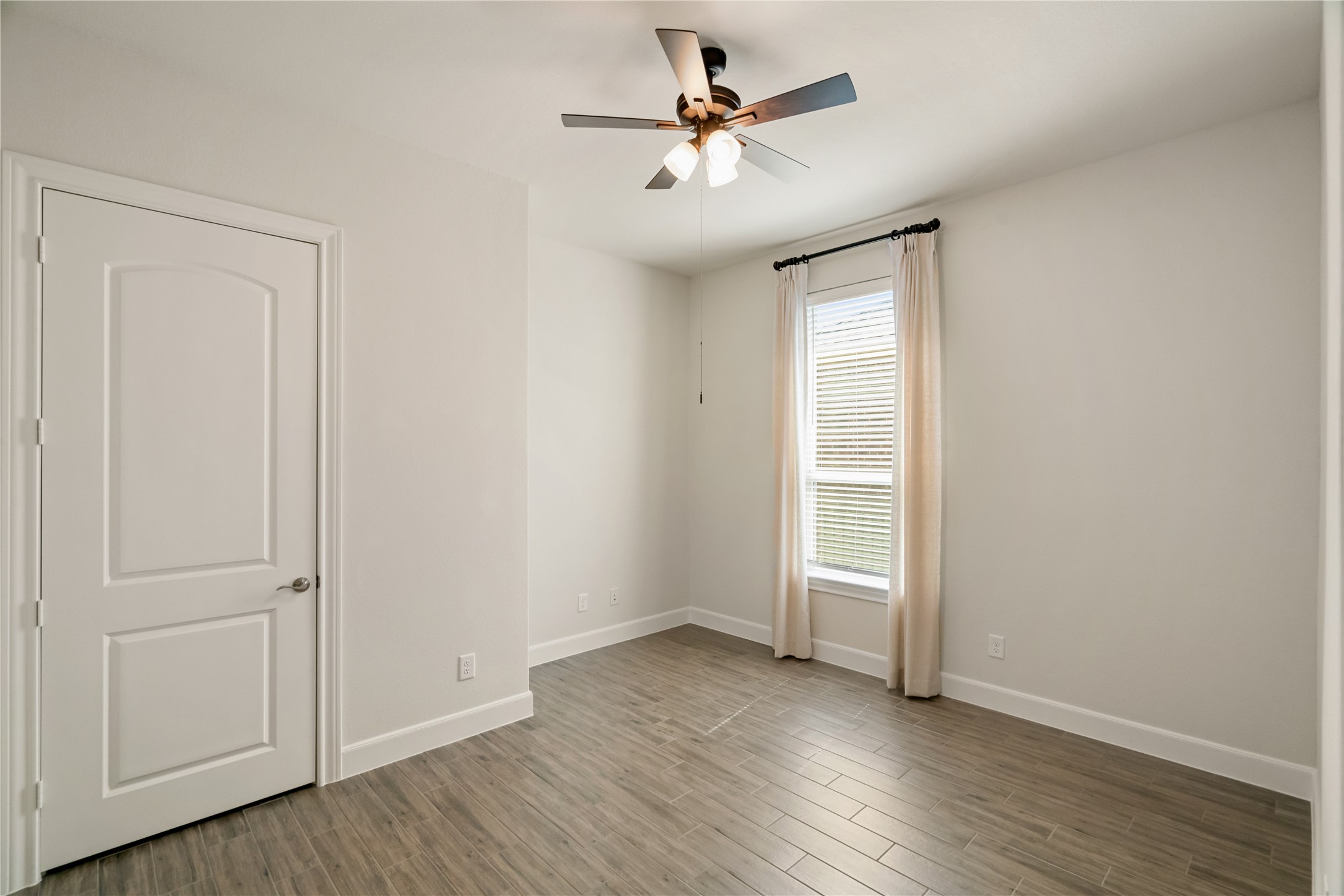 516 Nokota Drive Spring, TX 77382 - Photo 22 of 33 The larger of the two secondary bedrooms, this room has plenty of room for a queen bed or two singles. No shortage of light in this home. Walls continue to be pristine throughout the home.