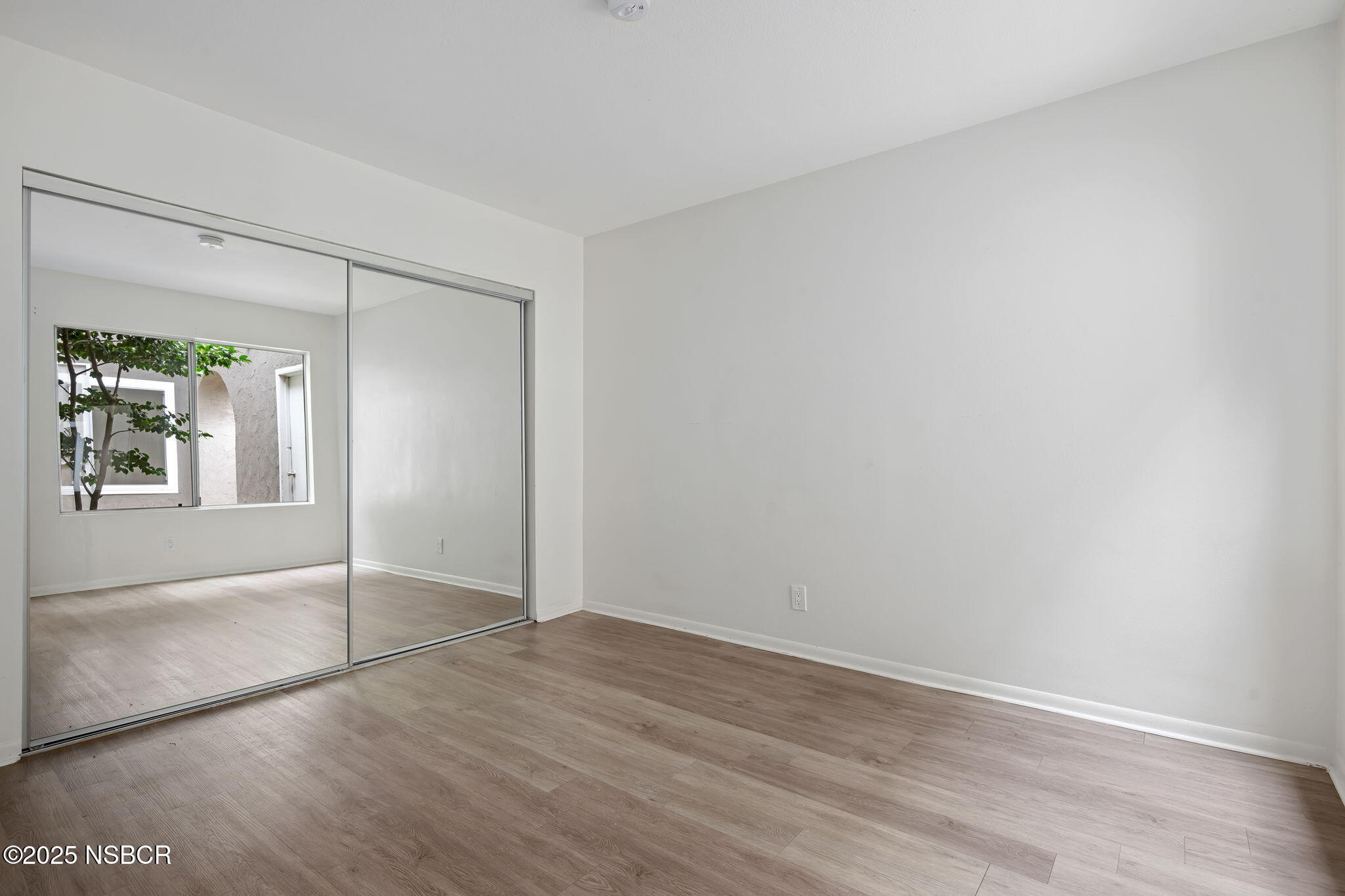 7344 Davenport Road Goleta, CA 93117 - Photo 13 of 21 wooden floor in an empty room