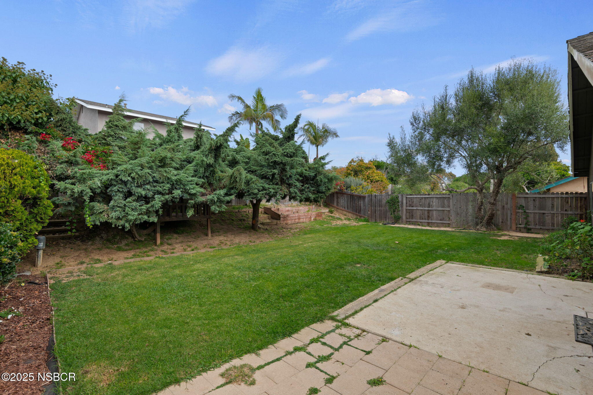 7344 Davenport Road Goleta, CA 93117 - Photo 17 of 21 a view of a backyard with potted plants and a fountain