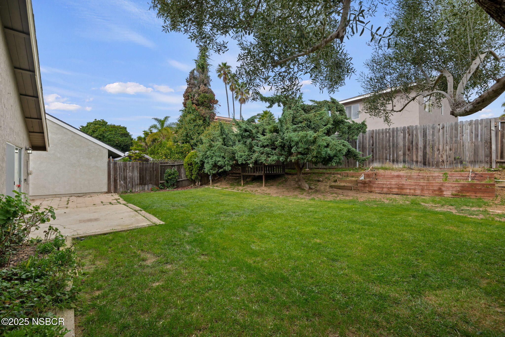 7344 Davenport Road Goleta, CA 93117 - Photo 18 of 21 a backyard of a house with lots of green space