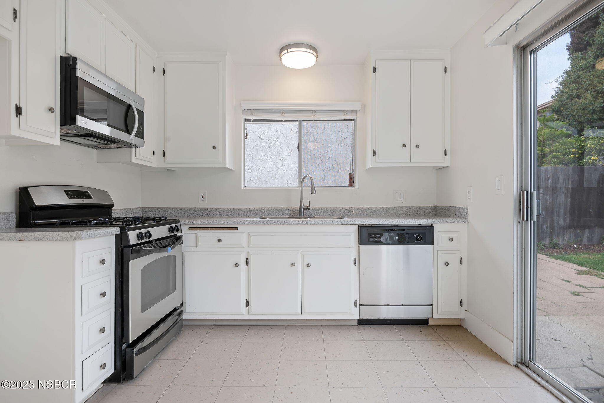 7344 Davenport Road Goleta, CA 93117 - Photo 9 of 21 a kitchen with stainless steel appliances white cabinets and a sink