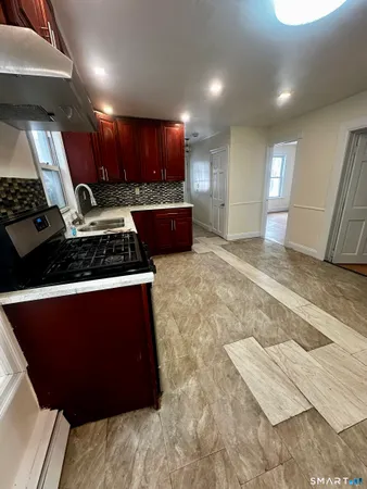 a kitchen with lots of counter top space and cabinets