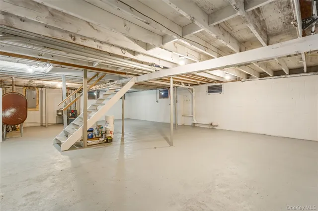 a bathroom with a shower a toilet and sink
