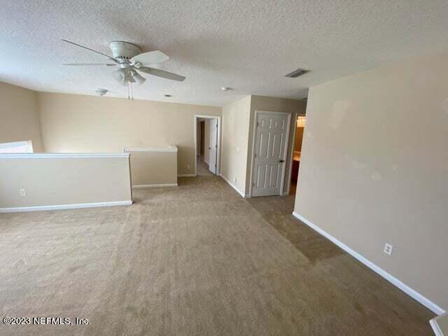 3301 Turkey Creek Drive Green Cove Springs, FL 32043 - Photo 14 of 36 a view of a livingroom with a ceiling fan and window
