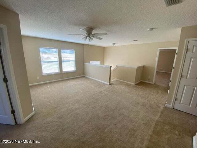 3301 Turkey Creek Drive Green Cove Springs, FL 32043 - Photo 15 of 36 a view of room with windows and refrigerator