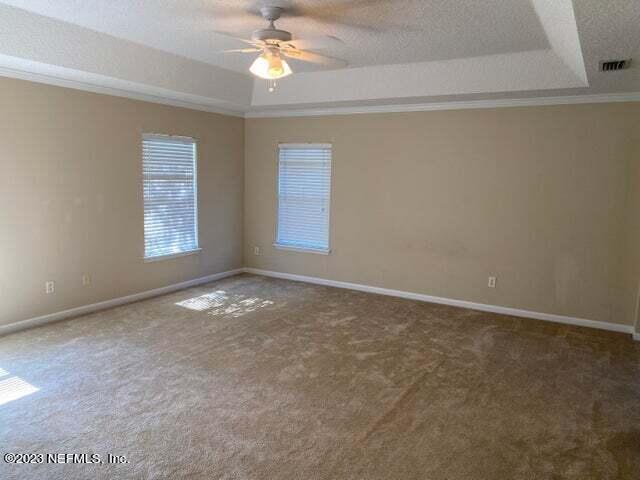 3301 Turkey Creek Drive Green Cove Springs, FL 32043 - Photo 17 of 36 an empty room with windows and fan
